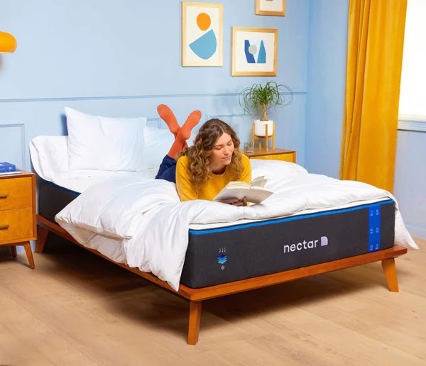 woman reading on her Nectar mattress