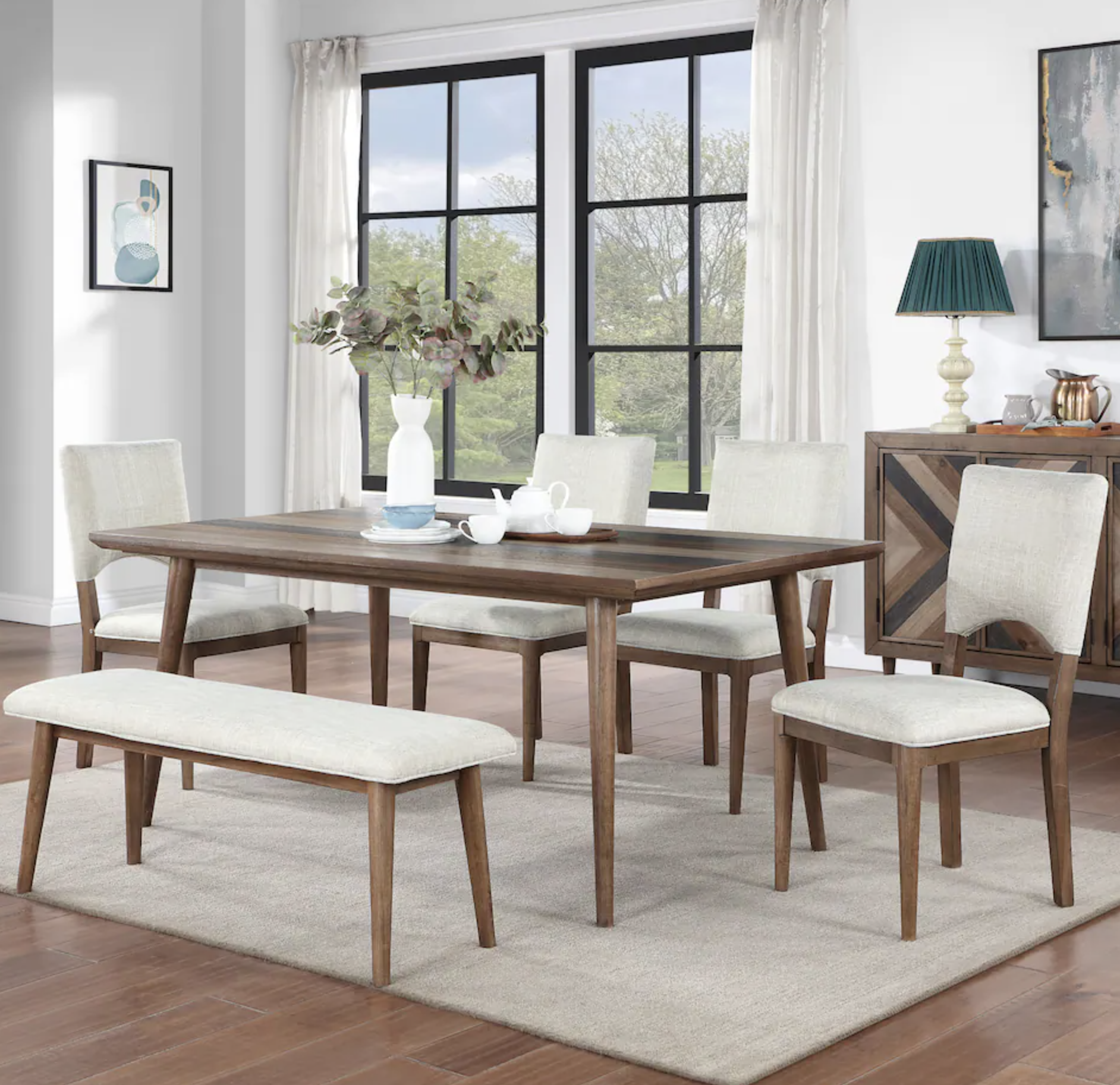 wood dining table with padded seats and a bench