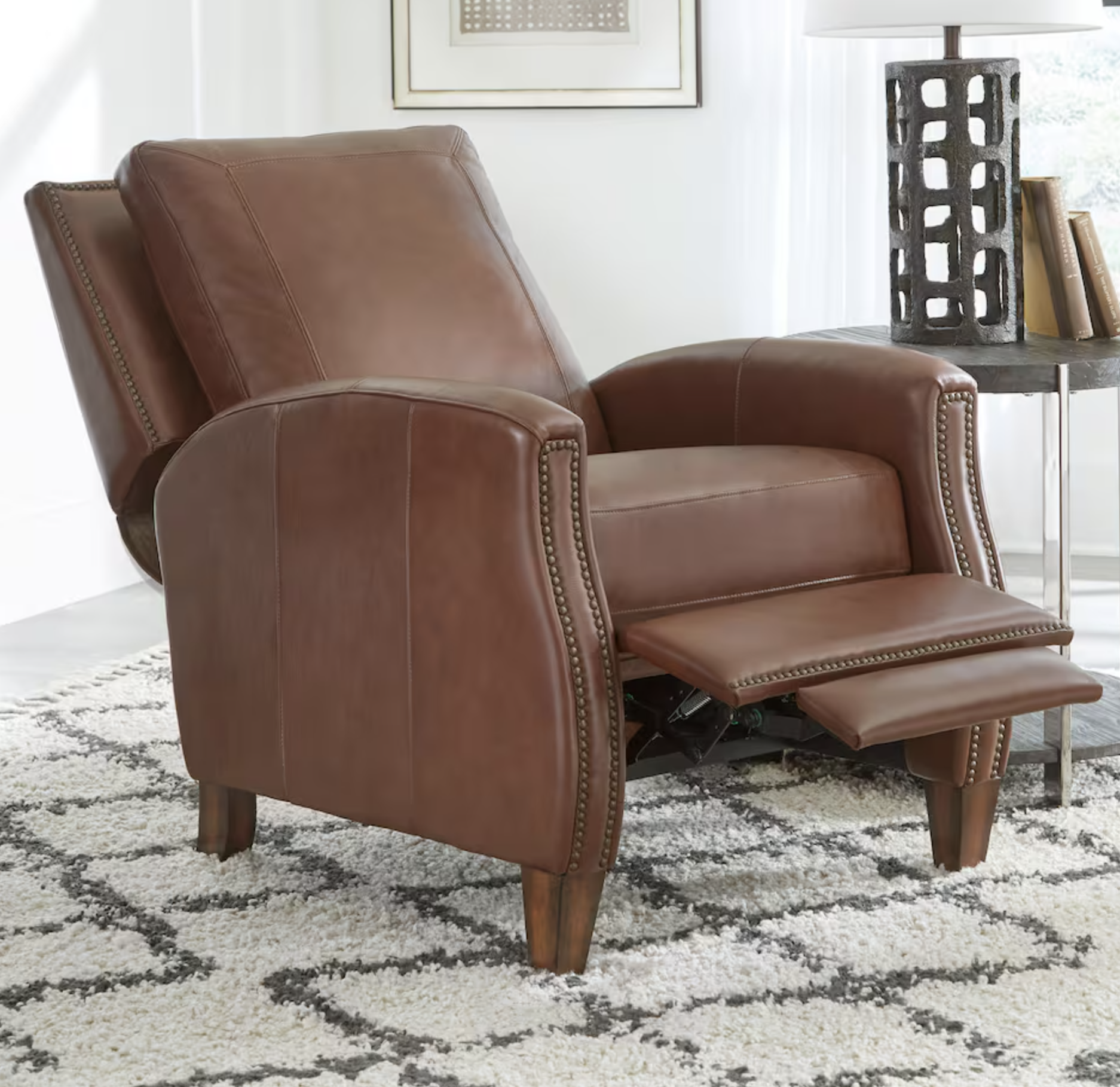 brown leather recliner with nail buttons partially reclined