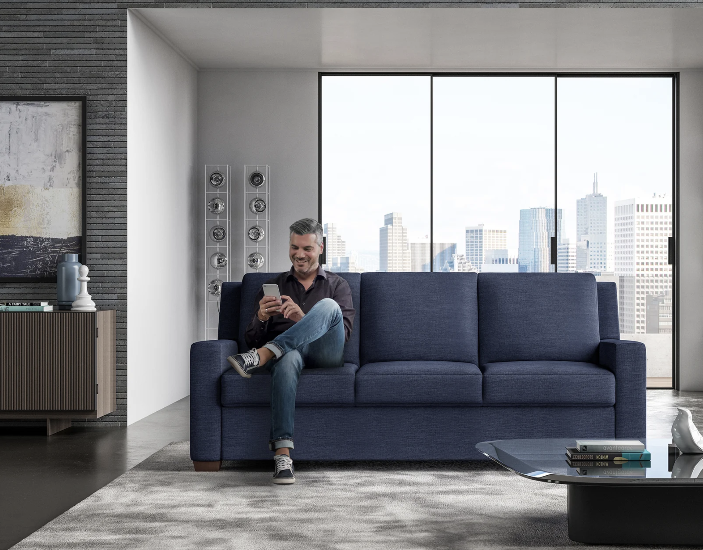 man sitting on blue sofa