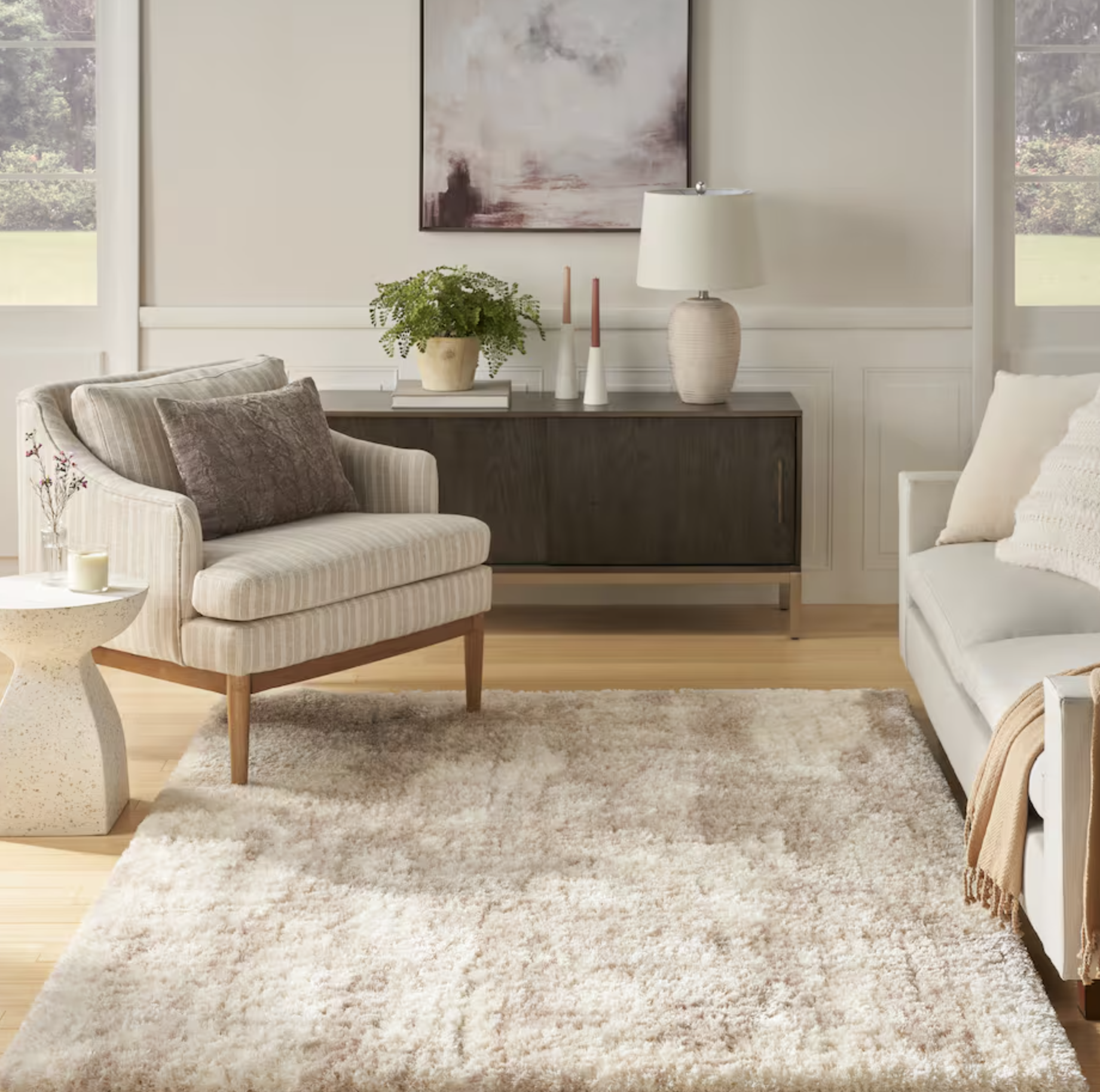area rug with accent chair, sofa, and console table