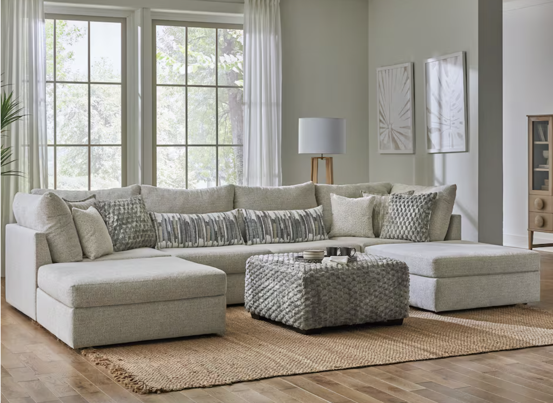 light gray U-shaped sectional and ottoman